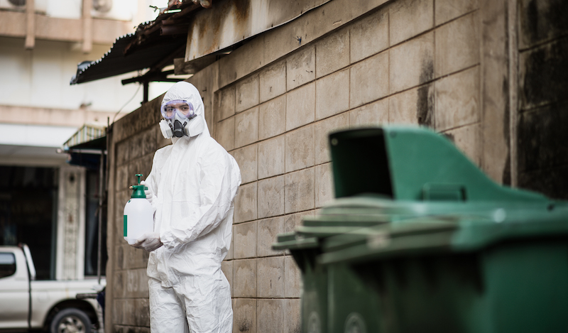 Disinfection specialist in PPE suit